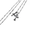 Kleine kruis- en babyfat-bedelketting met diamanten Kleine kruis- en babyfat-bedelketting met diamanten
